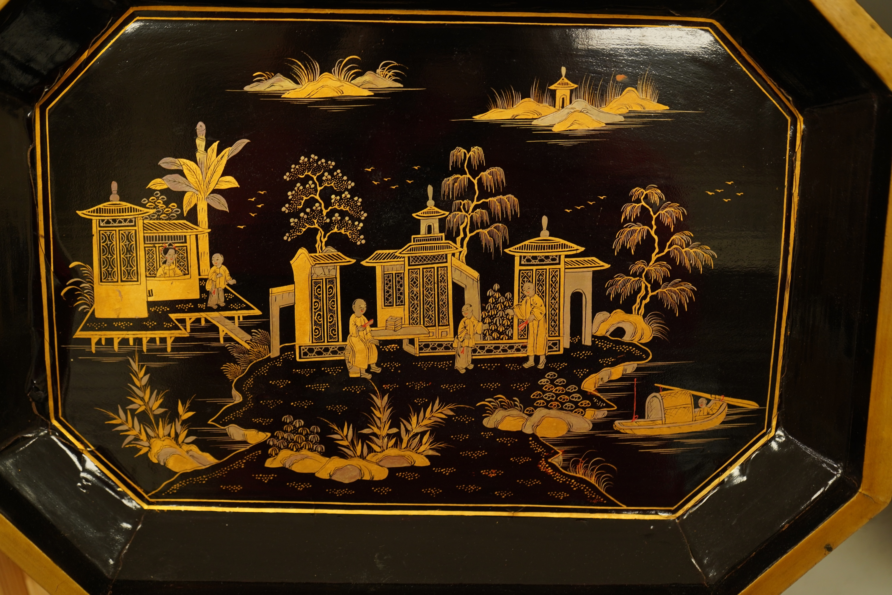 A Chinese export octagonal lacquered work box with fitted interior, 35cm wide